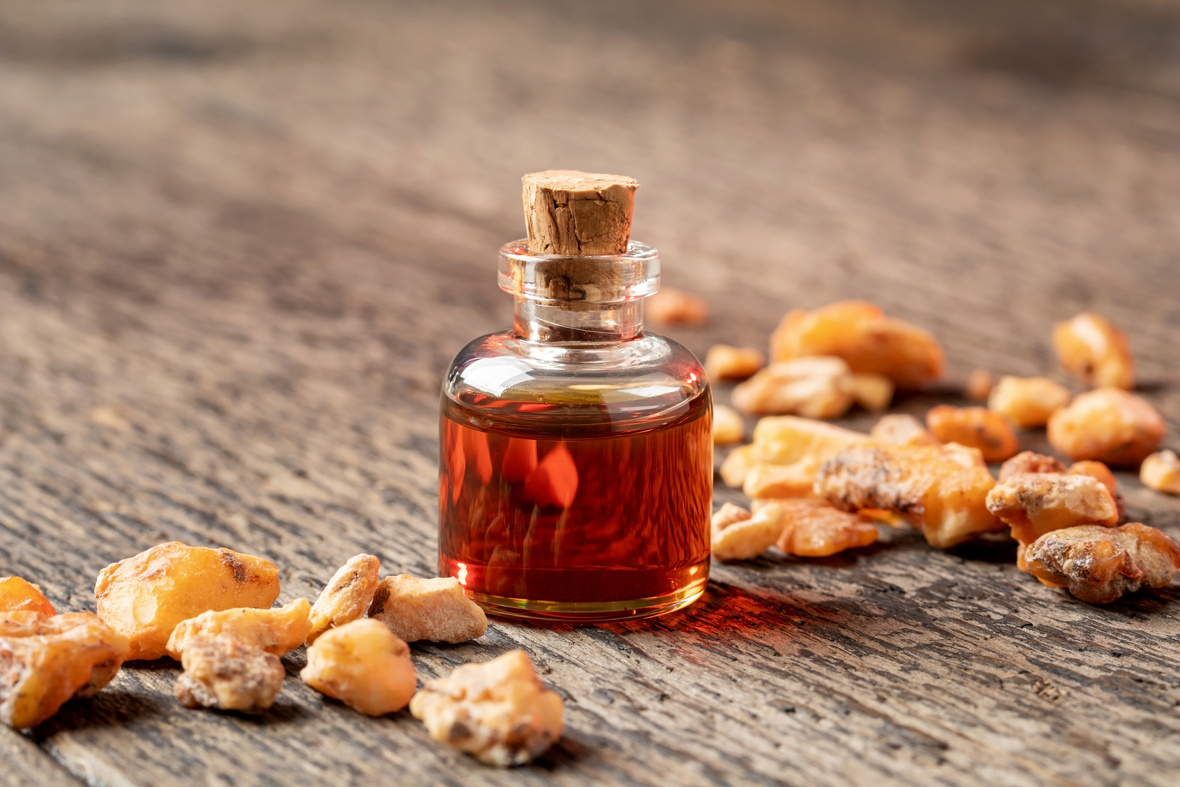 A bottle of styrax benzoin essential oil with benzoin resin