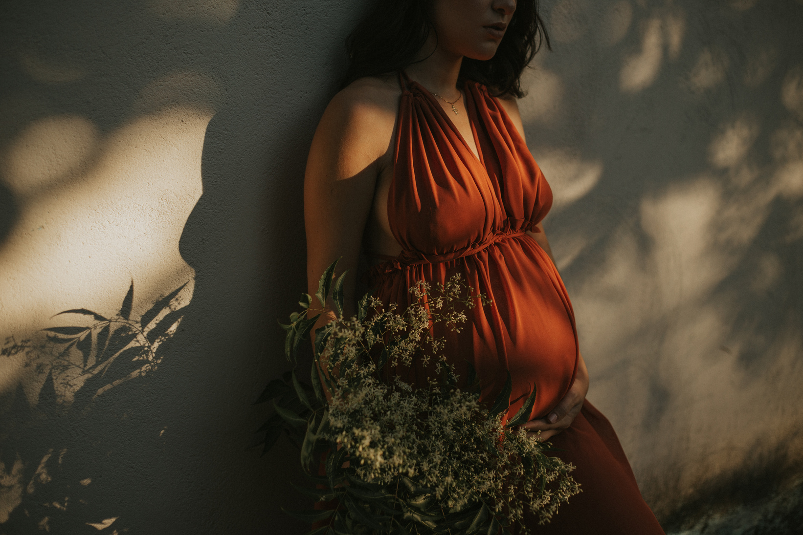 Woman Standing by the Wall